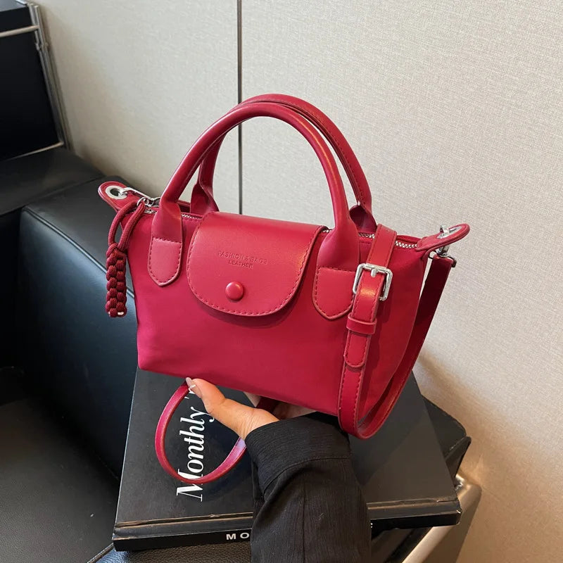 2025 new dragon fruit colored dumpling bag, Oxford cloth dragon splicing handbag, niche cross-border single shoulder crossbody