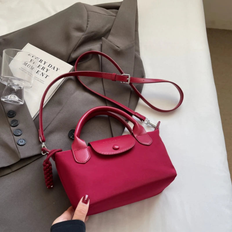 2025 new dragon fruit colored dumpling bag, Oxford cloth dragon splicing handbag, niche cross-border single shoulder crossbody