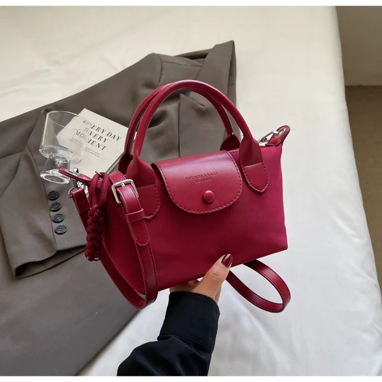 2025 new dragon fruit colored dumpling bag, Oxford cloth dragon splicing handbag, niche cross-border single shoulder crossbody